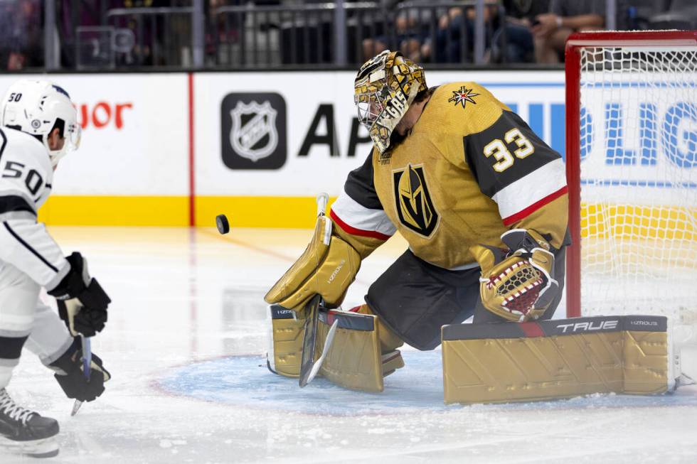 Kings forward Mikhail Maltsev (50) shoots while Golden Knights goaltender Adin Hill (33) prepar ...