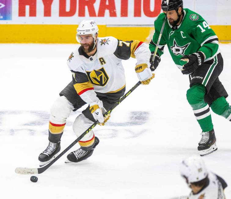 Golden Knights defenseman Alex Pietrangelo (7) drives past Dallas Stars left wing Jamie Benn (1 ...