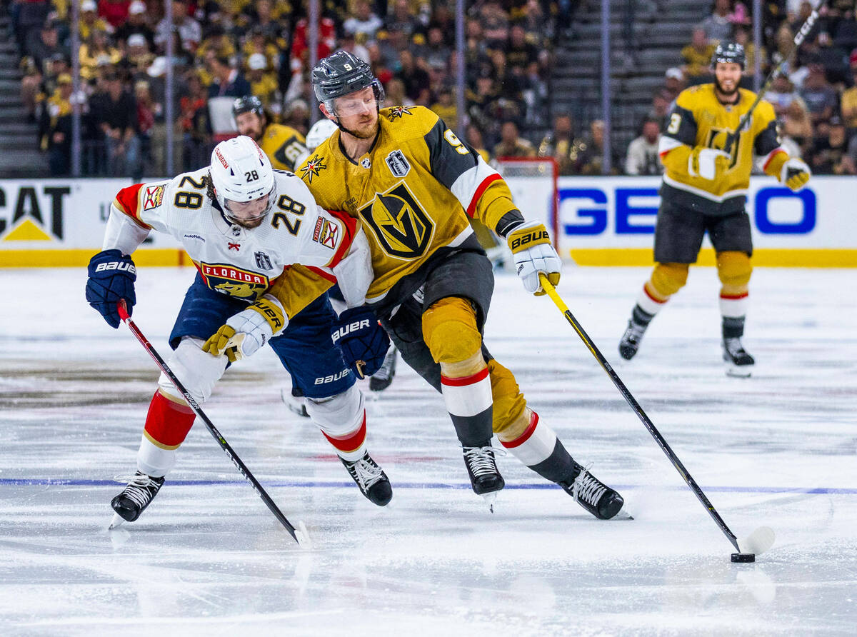 Golden Knights center Jack Eichel (9) controls the puck against Florida Panthers defenseman Jos ...