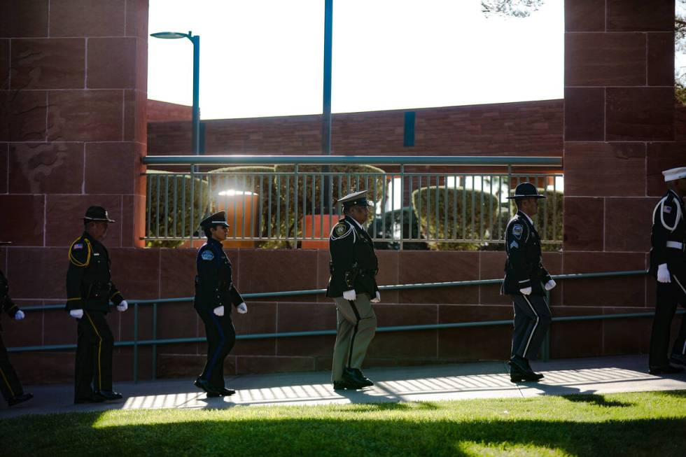 Members of the honor guard walk out of the 1 October Sunrise Remembrance ceremony at the Clark ...