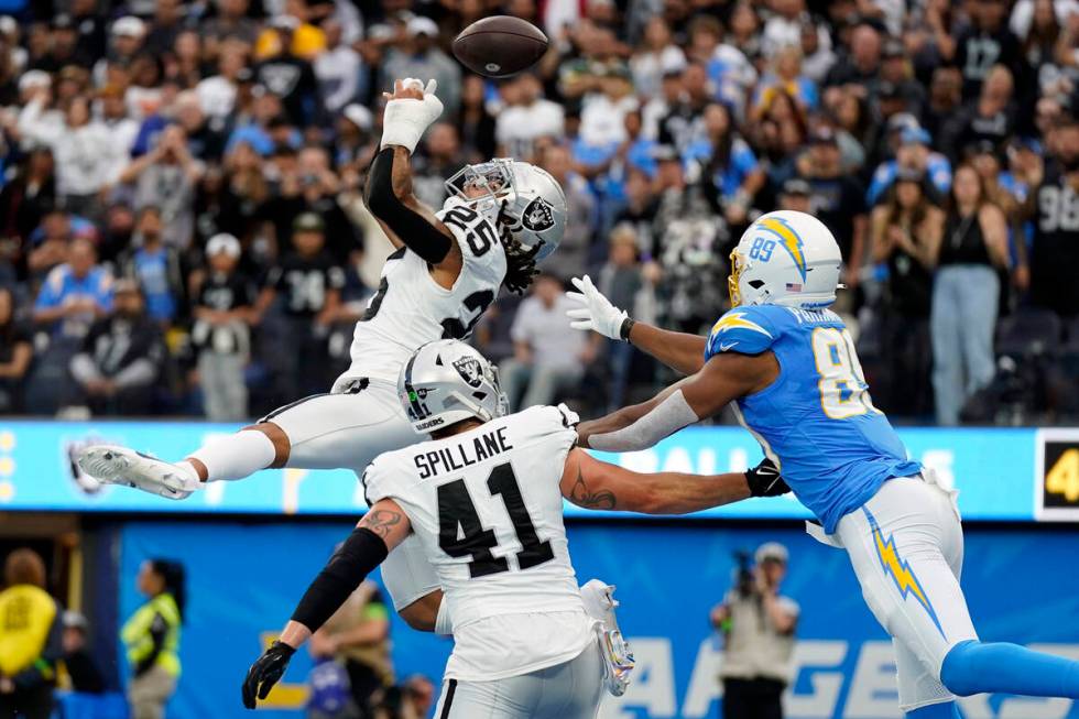 Las Vegas Raiders safety Tre'von Moehrig (25) breaks up a pass in the end zone intended for Los ...
