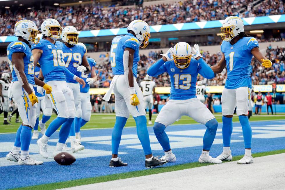 Los Angeles Chargers wide receiver Keenan Allen (13) celebrates his touchdown catch during the ...