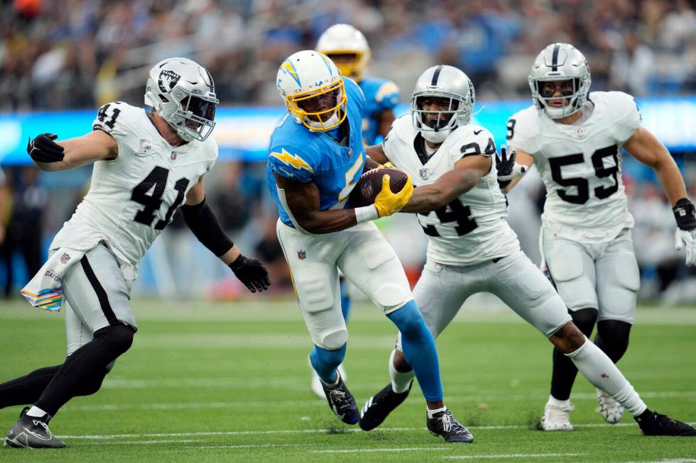 Los Angeles Chargers wide receiver Joshua Palmer runs after a catch against the Las Vegas Raide ...