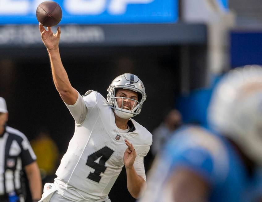 Raiders quarterback Aidan O'Connell (4) throws against the Los Angeles Chargers during the seco ...