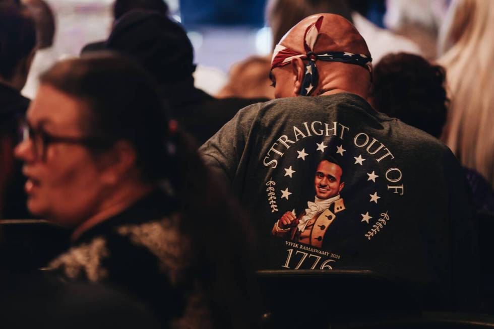 A Vivek Ramaswamy supporter waits to hear him speak at an event at Stoney’s Rockin&#x201 ...