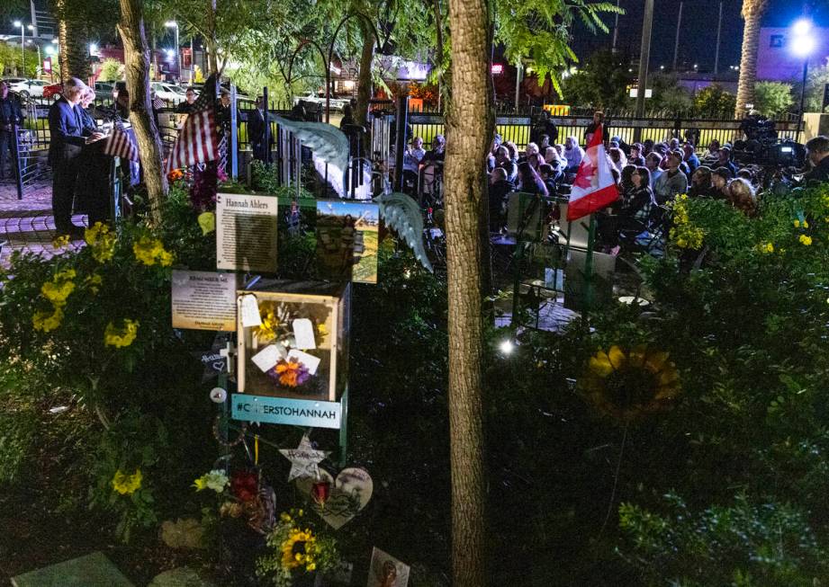 People gather at the Community Healing Garden as Mayor Carolyn Goodman and David Riggleman, Las ...