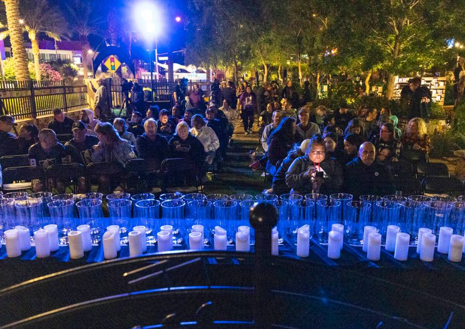 People gather at the Community Healing Garden for the reading of the names of the 1 October vic ...