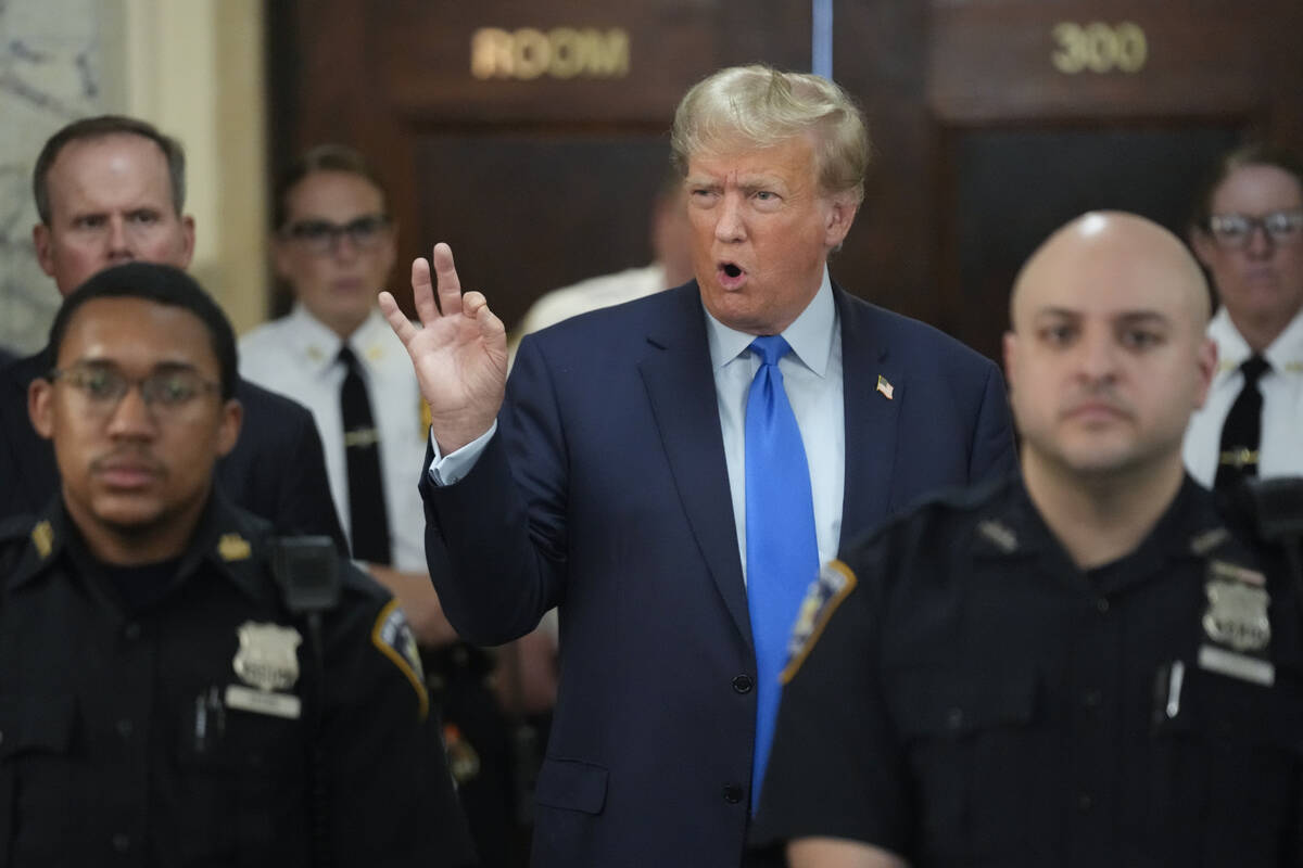 Former President Donald Trump speaks to reporters during a lunch break at New York State Suprem ...