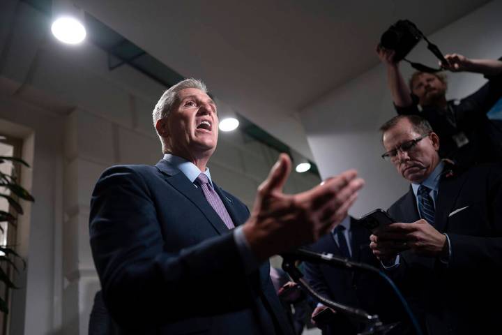 Speaker of the House Kevin McCarthy, R-Calif., talks to reporters after a closed-door meeting w ...