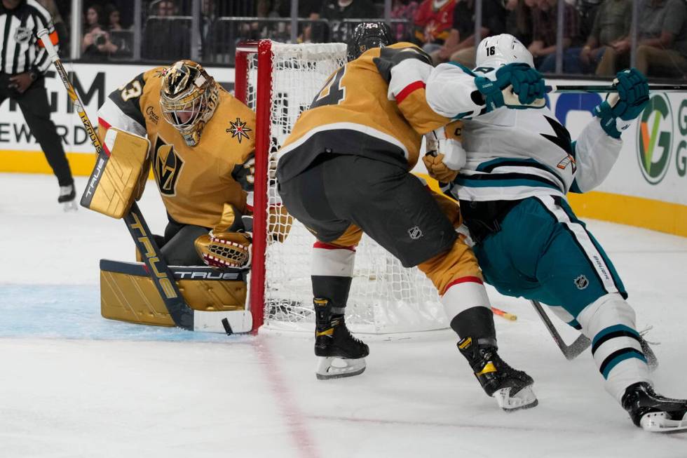 Vegas Golden Knights goaltender Adin Hill (33) stops a shot attempt by San Jose Sharks' Filip Z ...