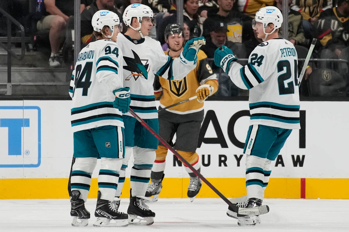 San Jose Sharks defenseman Jacob MacDonald, second from left, celebrates after scoring against ...