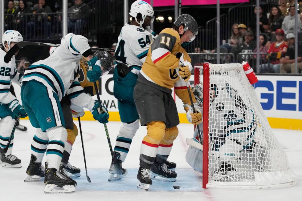 Vegas Golden Knights' Mason Morelli (11) tries to take a shot on San Jose Sharks goaltender Kaa ...