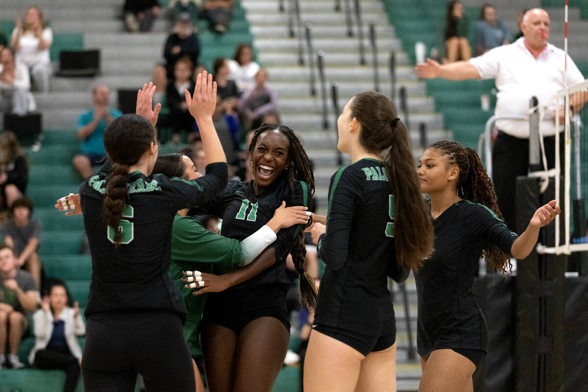Palo Verde celebrates a point by their Deloris Nangah (11) during a high school volleyball game ...