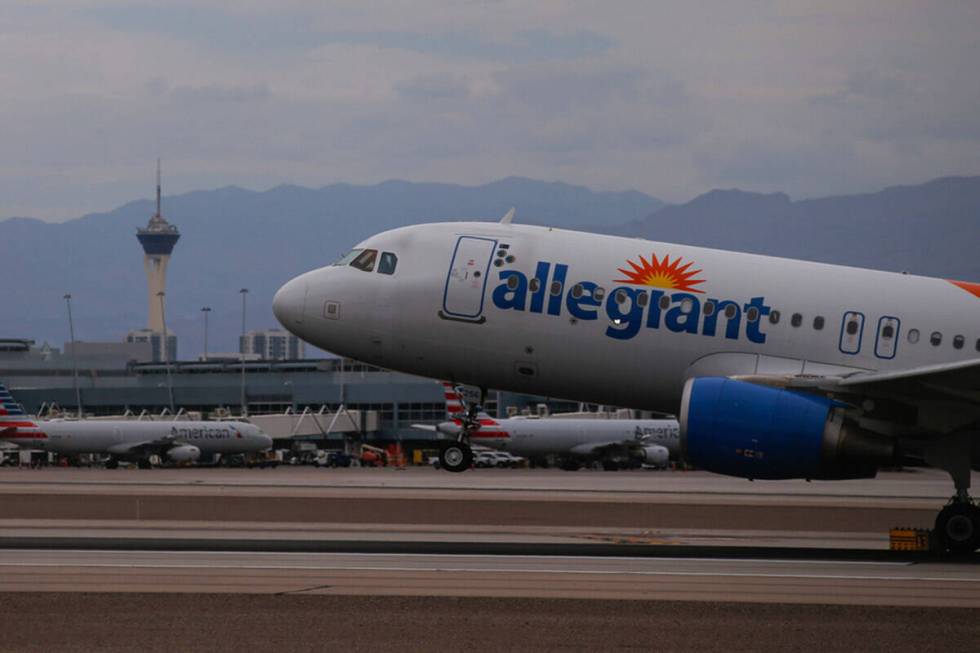 An Allegiant Air plane lands at Harry Reid International Airport on Tuesday, July 26, 2022, in ...