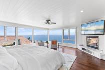 This Laguna Beach contemporary Mediterranean mansion offers 180-degree ocean vistas. It has bee ...