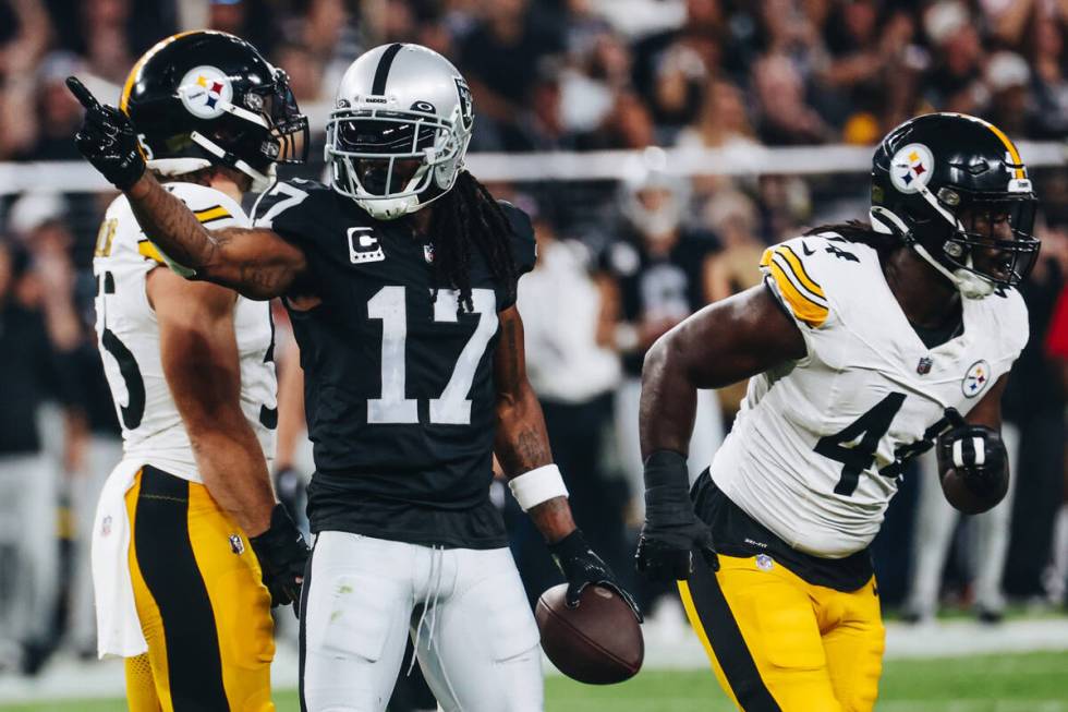 Raiders wide receiver Davante Adams (17) celebrates a run during the second half of a game agai ...