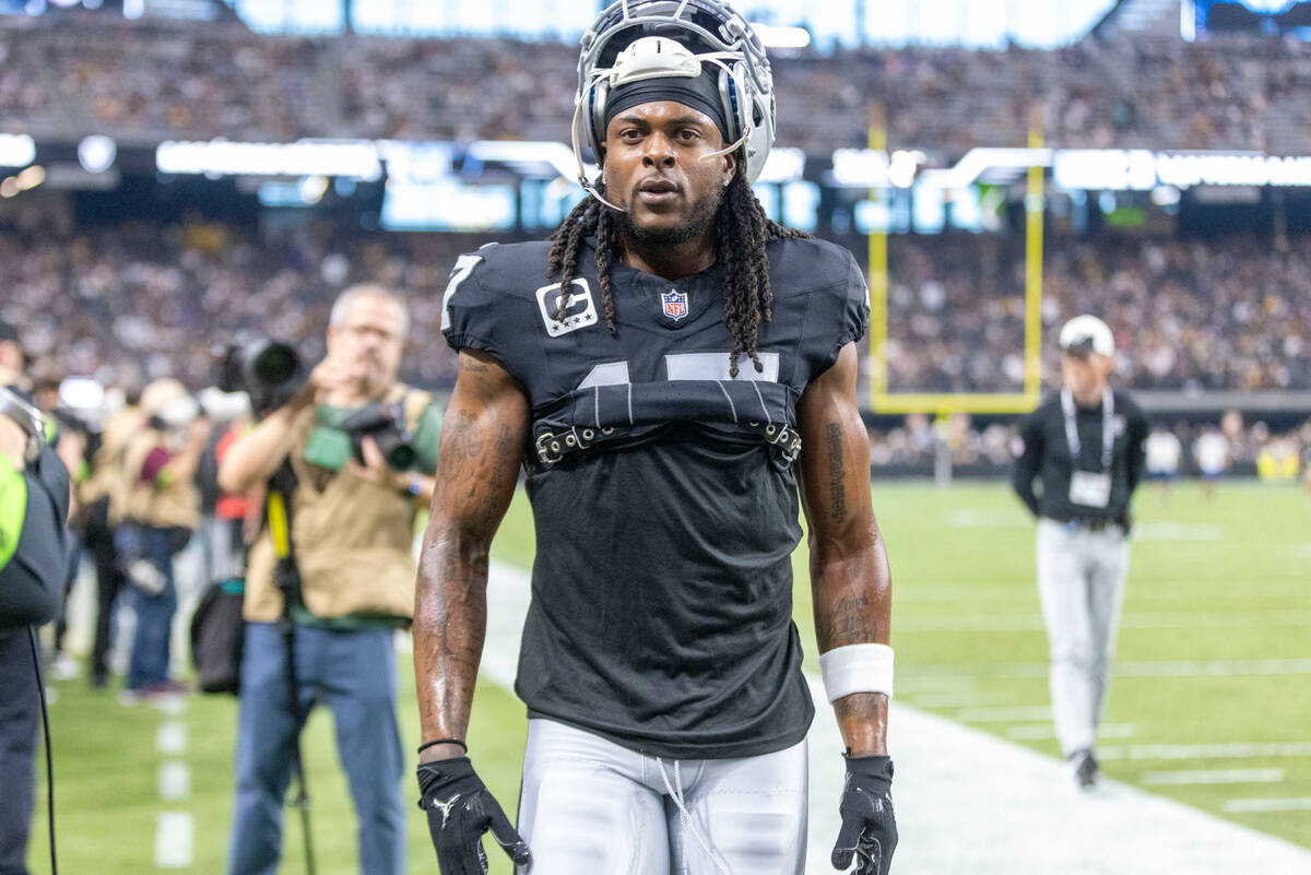 Raiders wide receiver Davante Adams (17) on the sideline before an NFL game against the Pittsbu ...