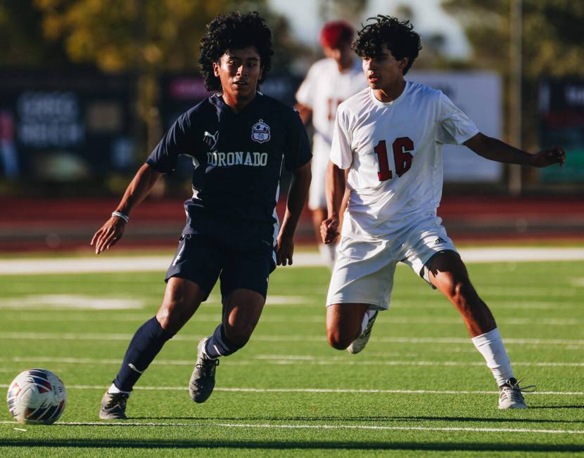 Coronado’s Mark Abijmil (4) and Arbor View midfielder Anthony Medina (16) run after the ...