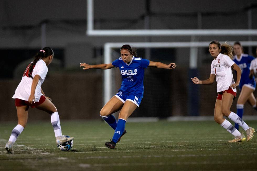 Bishop Gorman midfielder Ava Lazzara (16) defends against Liberty midfielder Adriana Gonzalez ( ...