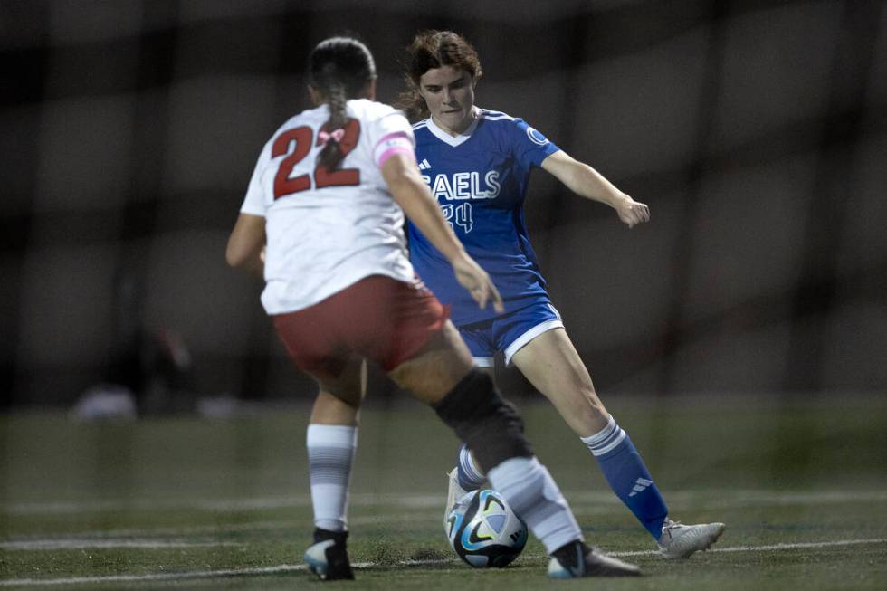 Bishop Gorman's Hunter Borgel (24) drives toward the goal while Liberty defender Leilani Harwor ...