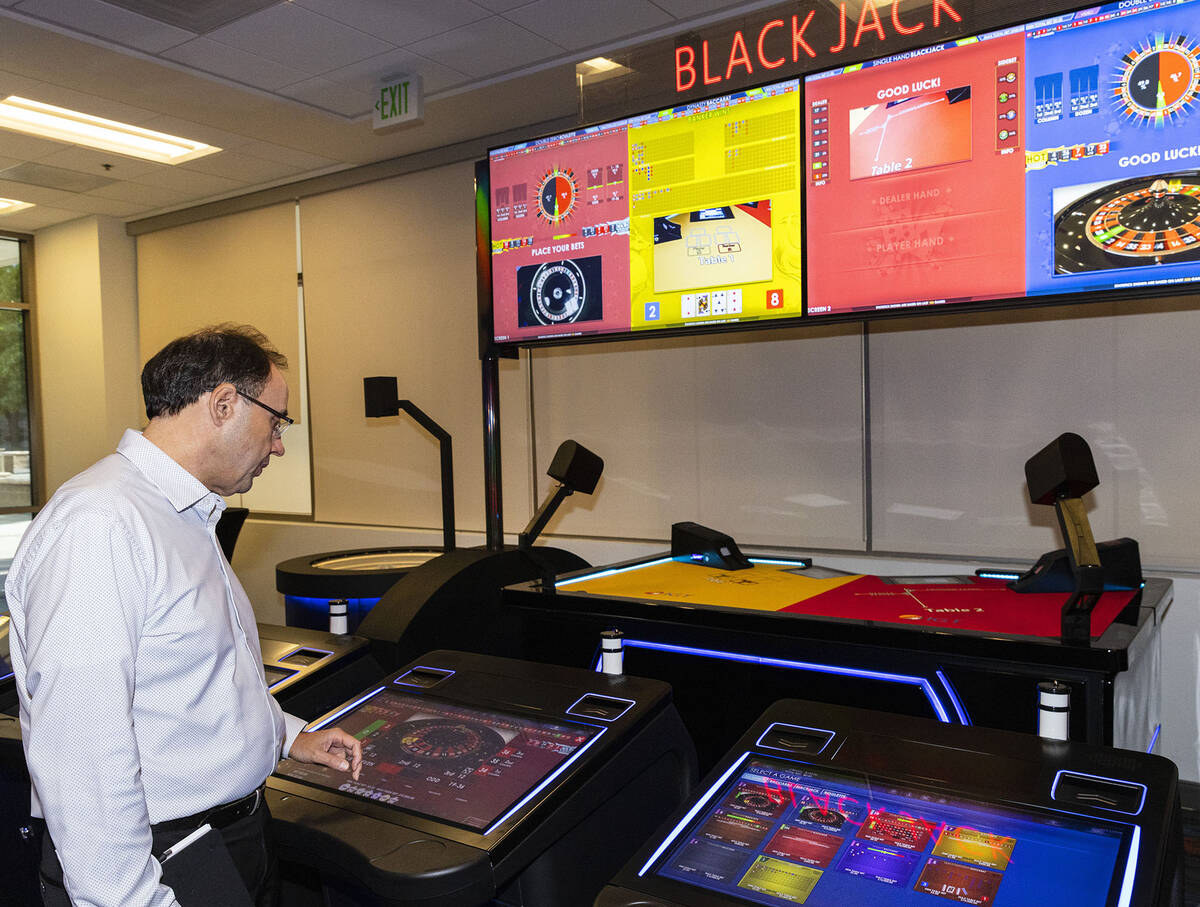 Nick Khin, a COO of Gaming for IGT, gives a tour of new gaming technology, including electronic ...