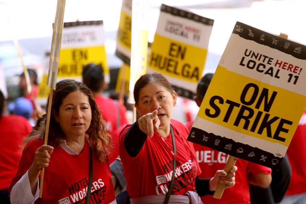 Hotel workers picket outside the Biltmore Hotel as members of Unite Here Local 11 joined dozens ...