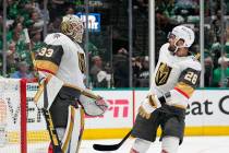 Vegas Golden Knights goaltender Adin Hill (33) and left wing William Carrier (28) celebrate aft ...