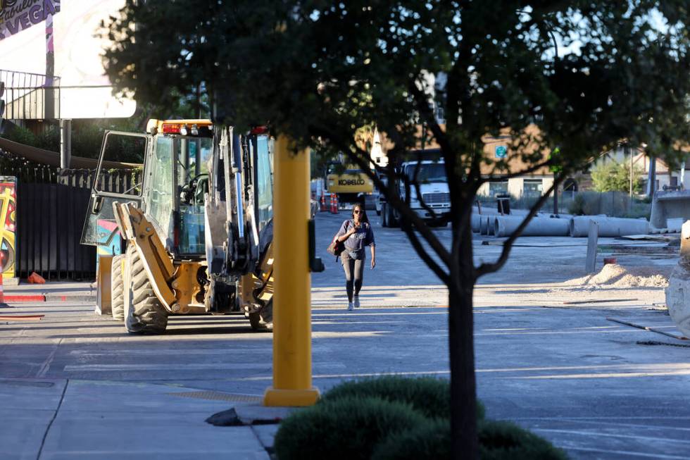 A pedestrian walks on Seventh Street at Carson Avenue in downtown Las Vegas as construction con ...