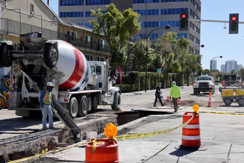 A pedestrian walks on Seventh Street at Carson Avenue in downtown Las Vegas as construction con ...