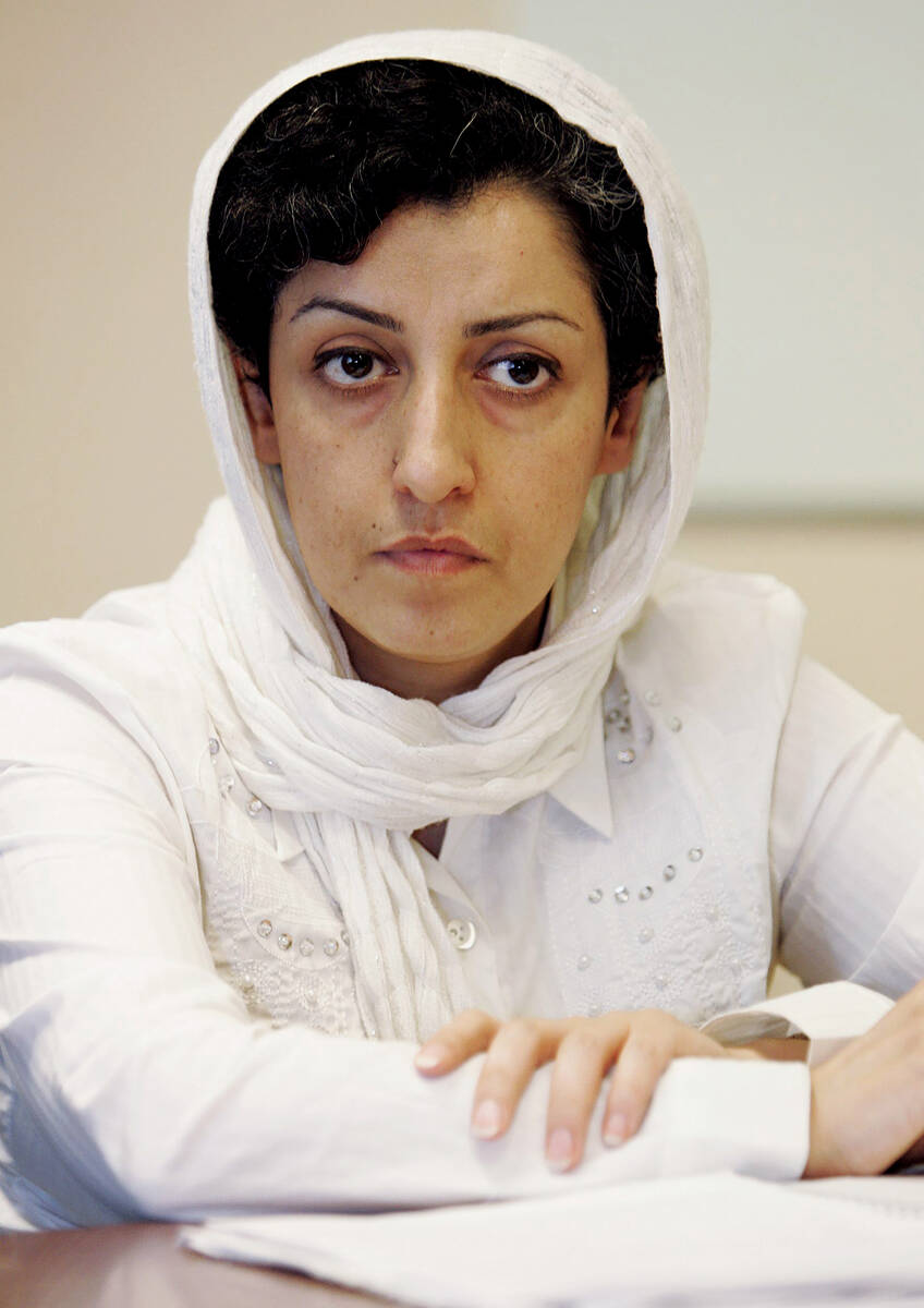 FILE - Iranian Narges Mohammadi, delegate of the Center for Human Rights Defenders, listens to ...