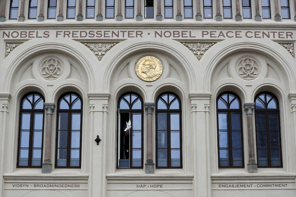 At 12.00 a dove symbolising peace flies from the window of the Nobel Peace Center in connection ...