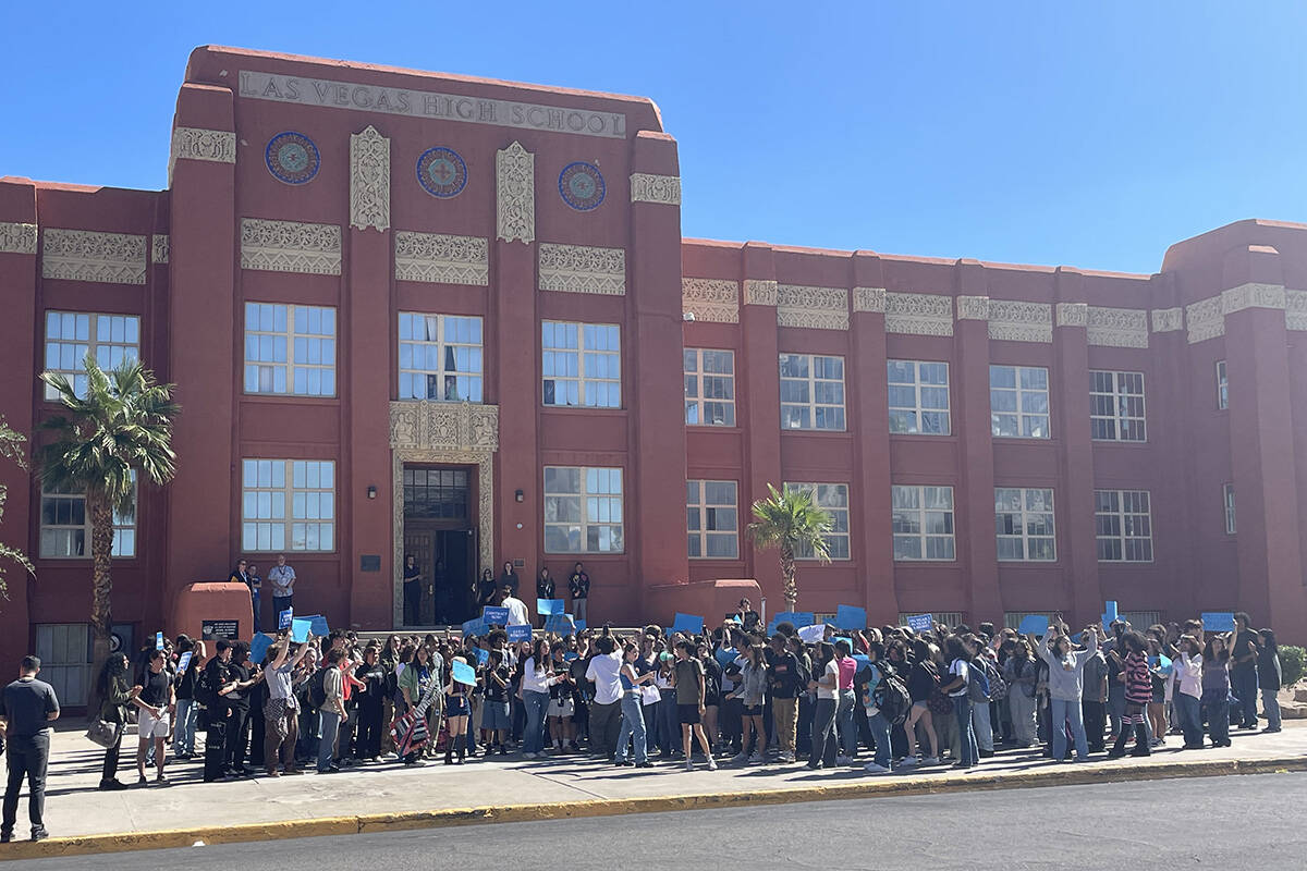 Students walk out of Las Vegas Academy of the Arts on Friday, Oct. 6, 2023, calling for teacher ...