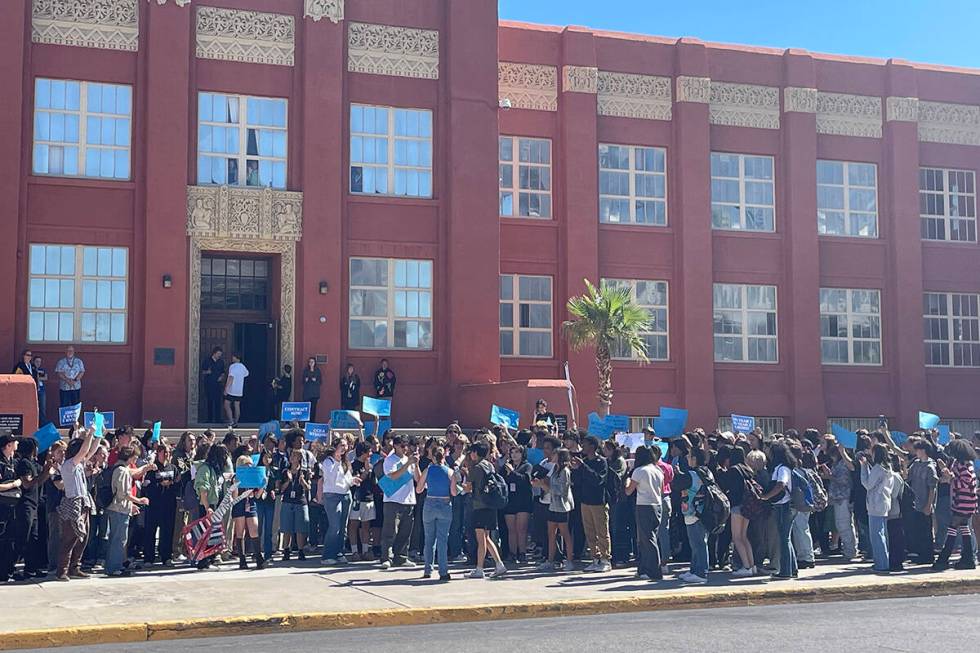 Students walk out of Las Vegas Academy of the Arts on Friday, Oct. 6, 2023, calling for teacher ...