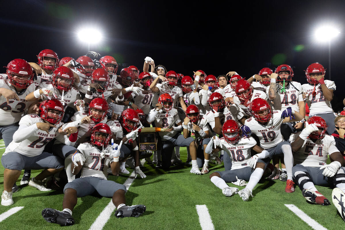 Arbor View celebrates with their rivalry Battle of the Bulls trophy after winning their high sc ...