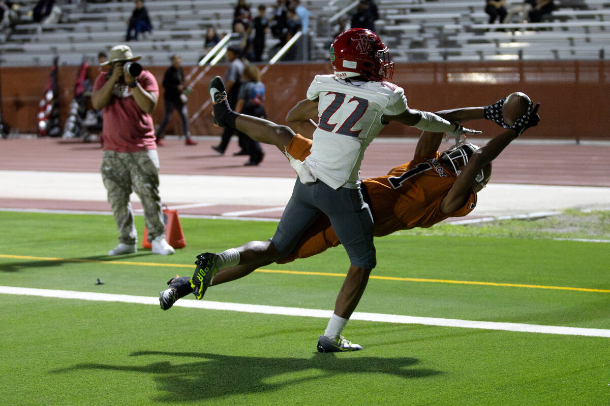 Legacy wide receiver Dominic Oliver (1) catches a touchdown pass while Arbor View cornerback Ad ...