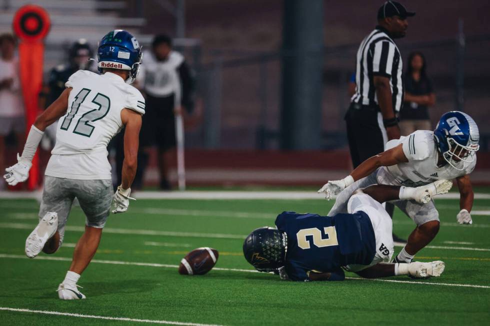 Foothill wide receiver Tarrell Mack-Lovely falls on the ground during an attempted pass during ...