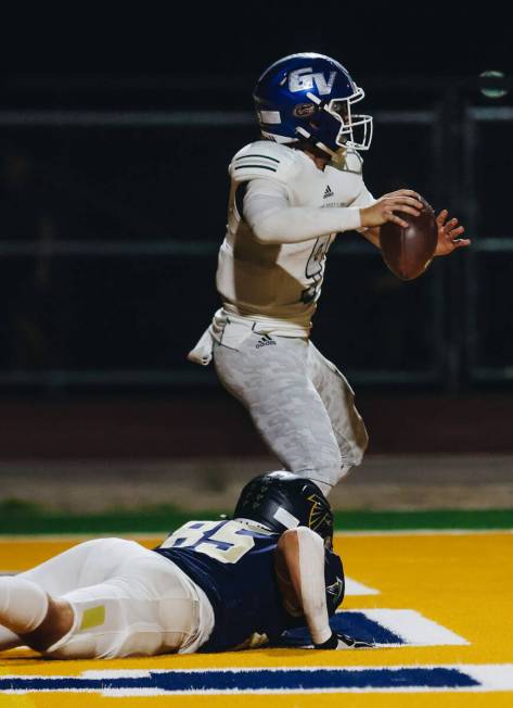 Green Valley quarterback Jack Thow (9) throws the ball as Foothill defensive end Dallin Bair (8 ...