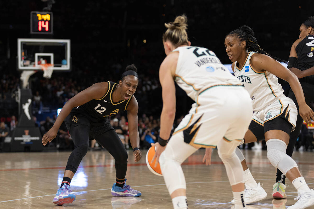 Las Vegas Aces guard Chelsea Gray (12) loses control of the ball to New York Liberty guard Cour ...
