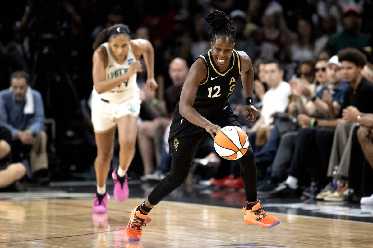 Las Vegas Aces guard Chelsea Gray (12) runs up the court after stealing the ball from New York ...