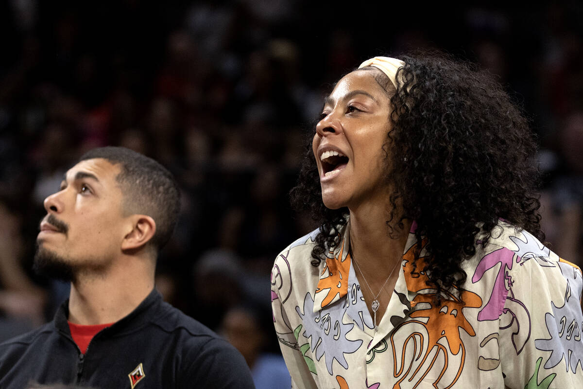 Las Vegas Aces forward Candace Parker, who is out with a foot injury, shouts from the bench dur ...