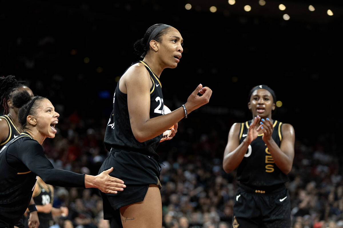 Las Vegas Aces forward A'ja Wilson (22) is confused about a foul while her teammates celebrate ...