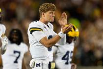 Michigan quarterback J.J. McCarthy (9) celebrates during the second half of an NCAA college foo ...