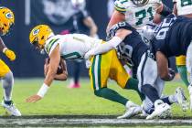 Green Bay Packers quarterback Jordan Love (10) is sacked by Raiders defensive end Maxx Crosby ( ...