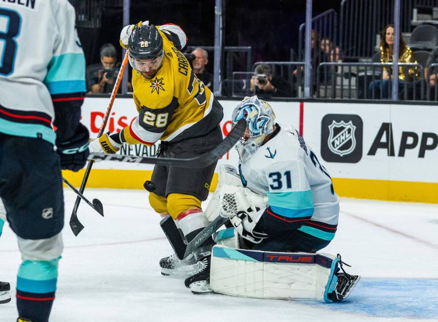 Golden Knights left wing William Carrier (28) attempts to score against Seattle Kraken goaltend ...