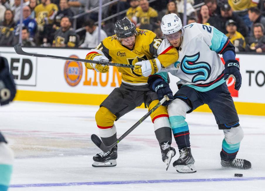 Golden Knights right wing Jonathan Marchessault (81) battles for the puck with Seattle Kraken c ...