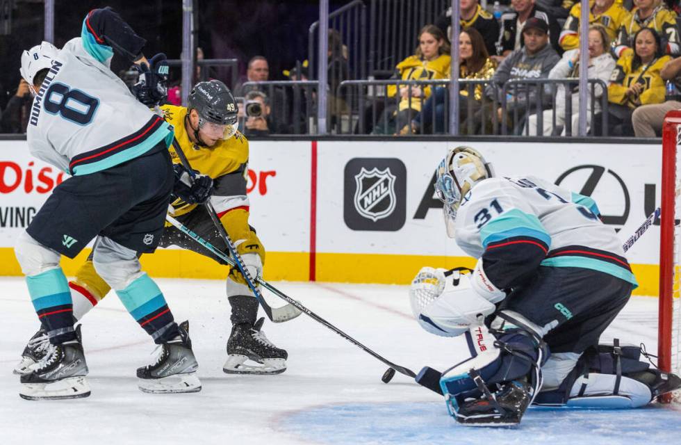 Golden Knights center Ivan Barbashev (49) looks to score on Seattle Kraken goaltender Philipp G ...