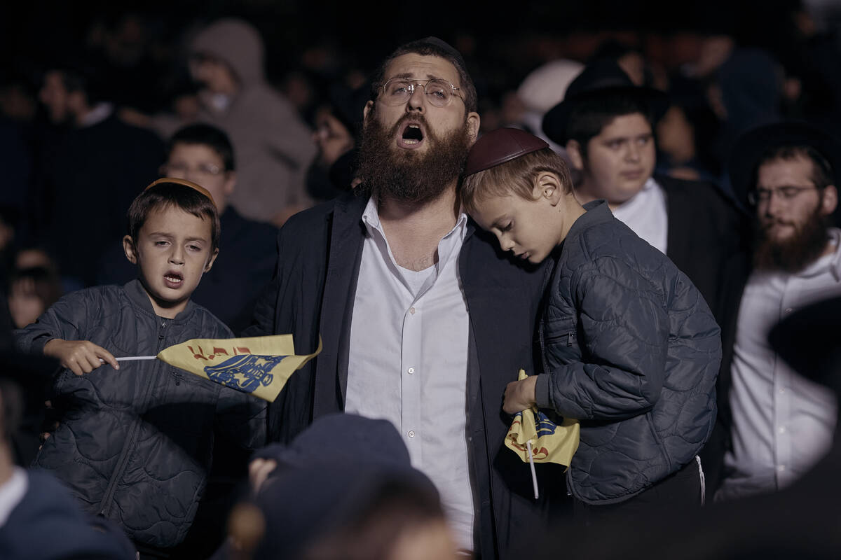 Chabad-Lubavitch Orthodox Jews sing during a vigil held in solidarity and prayer for Israel on ...