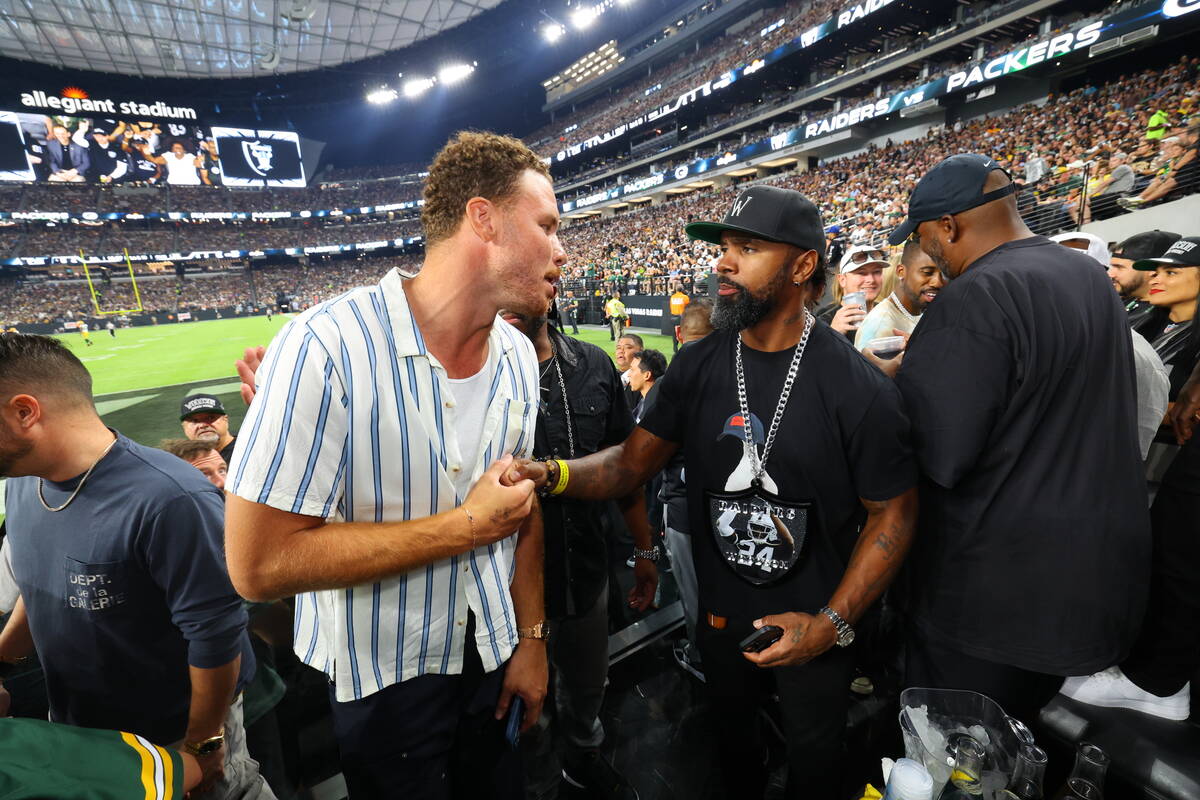 Boston Celtics forward Blake Griffin and former Raiders star Charles Woodson are shown during W ...