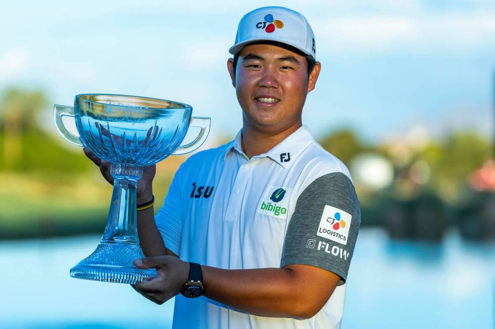 Tom Kim holds up his winning trophy during the final day of play in the Shriners Children's Ope ...