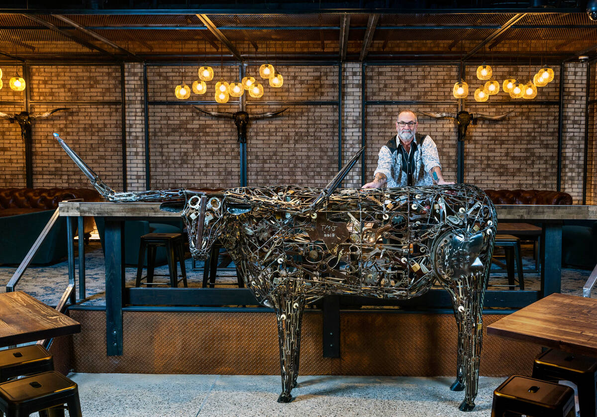 Stoney's North Forty owner Chris Lowden with a Longhorn steer art piece as part of the new coun ...